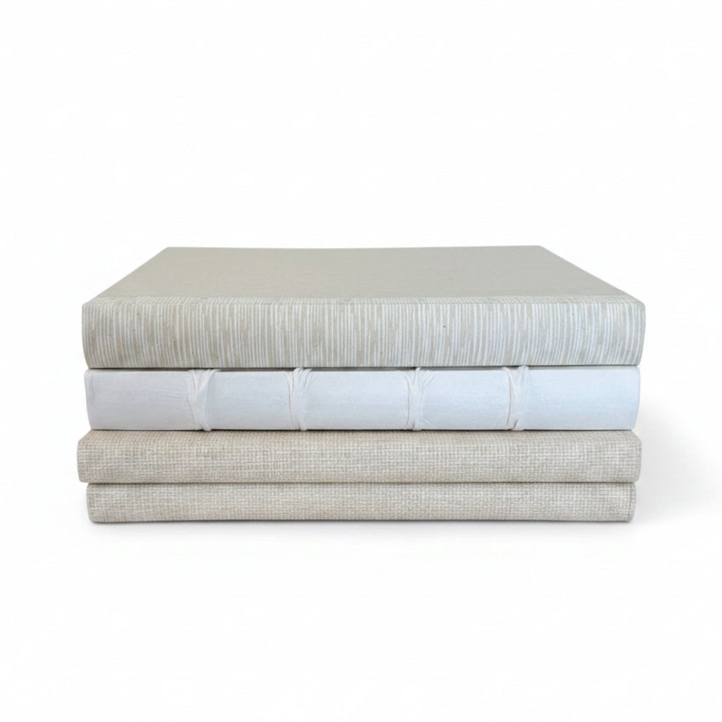 Four Hardcover Stacked Books